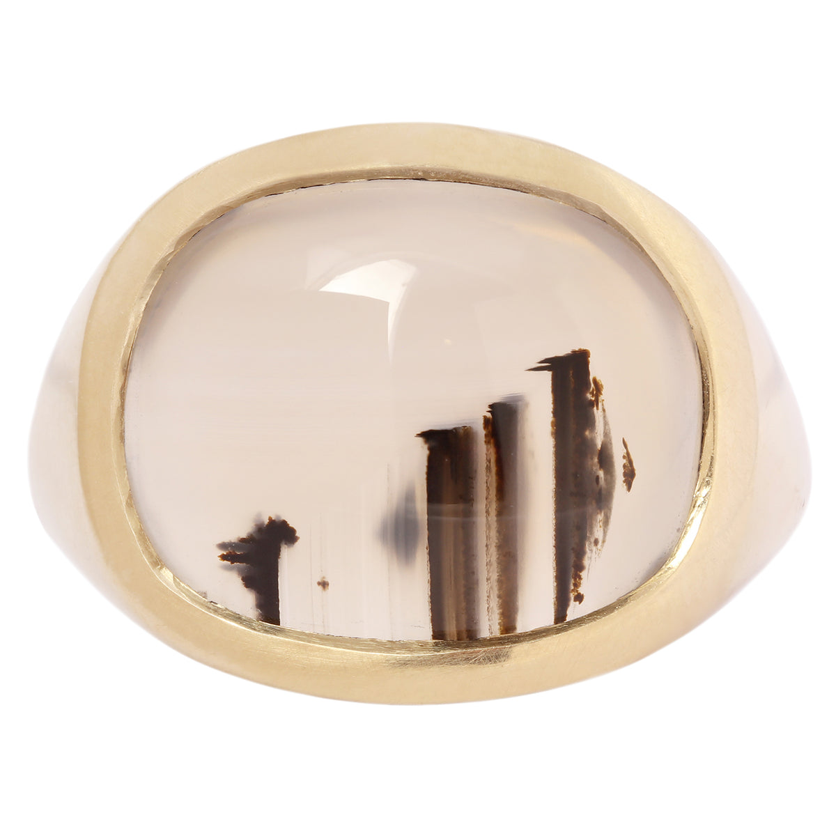 Gold ring with a large, round, white stone on a white background