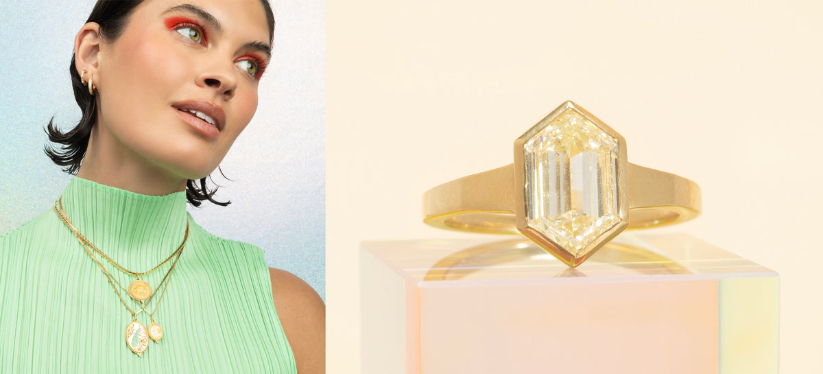 Woman wearing gold jewelry with a close-up of a gold ring on a light pink background