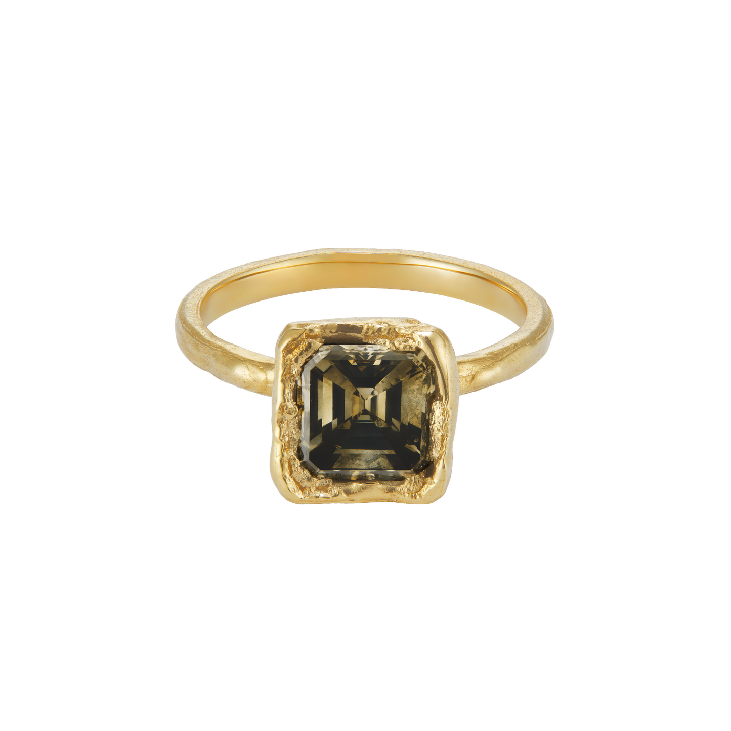 A gold ring featuring a square-cut dark smoky gemstone in a textured bezel setting, shown against a plain white background.