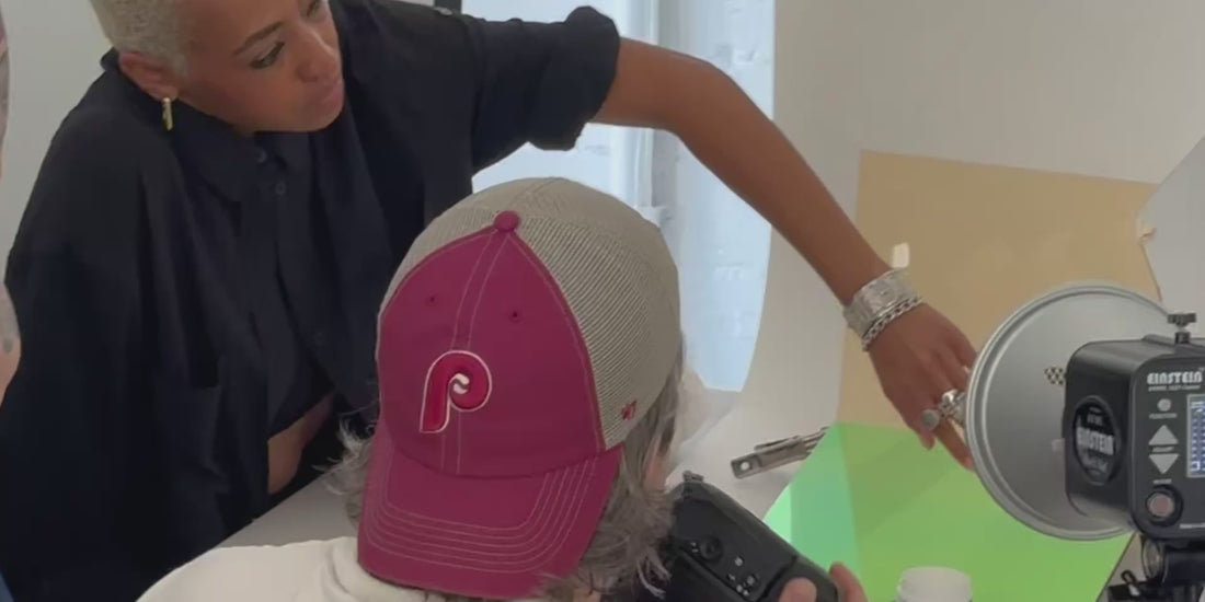 behind-the-scenes video of a jewelry photoshoot featuring a hand model and photographer