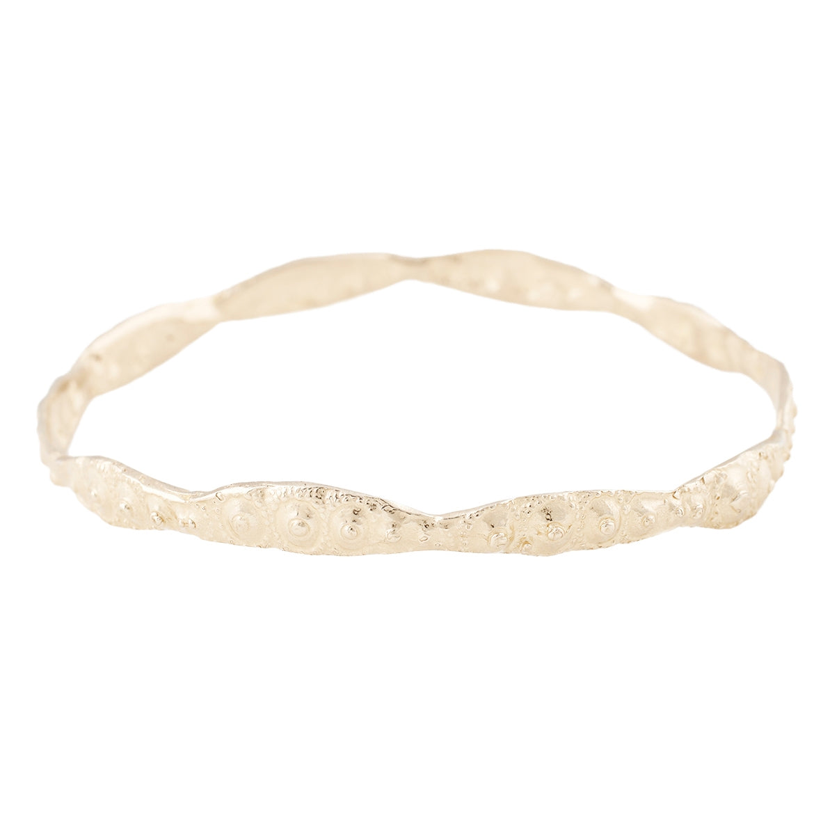 Sea urchin textured gold bangle pictured on a white background - Lauren Wolf Jewelry | ESQUELETO 