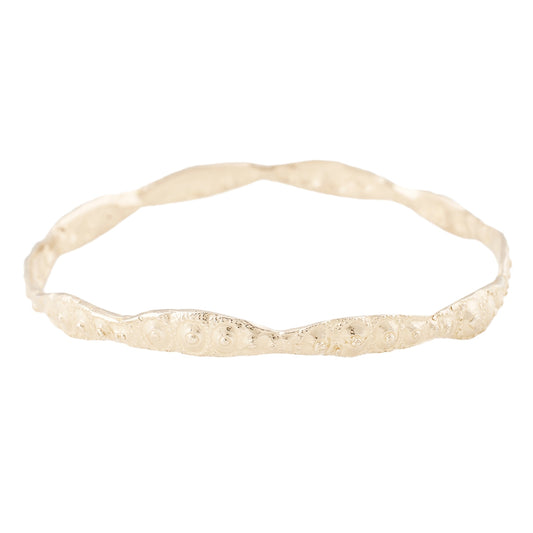 Sea urchin textured gold bangle pictured on a white background - Lauren Wolf Jewelry | ESQUELETO 