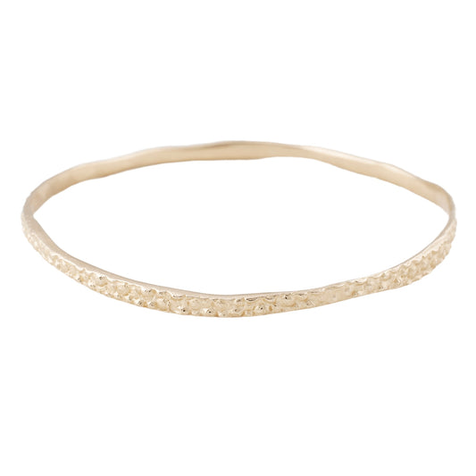 14k Gold Stingray Bangle from Lauren Wolf Jewelry against a white background
