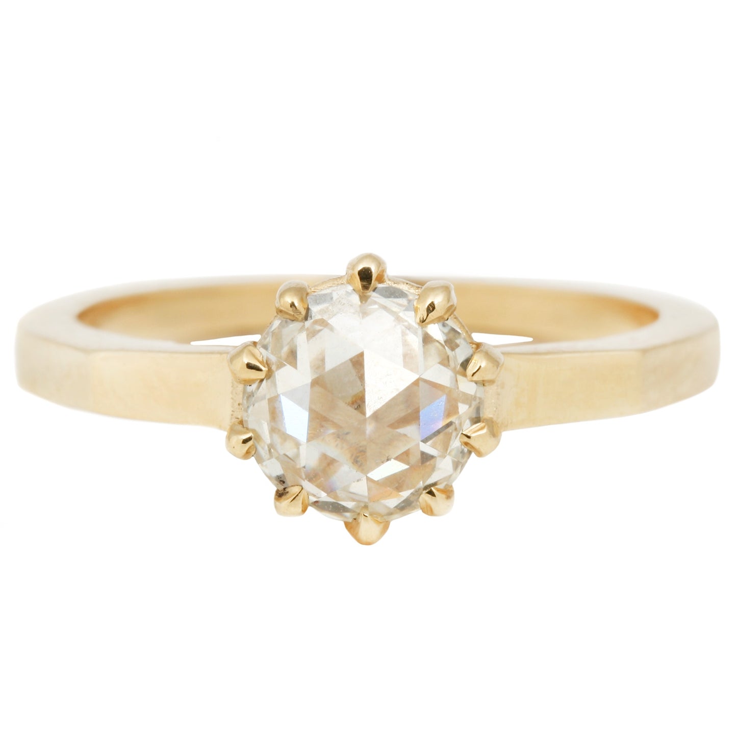 Lauren Wolf - Gold ring with a large diamond on a white background