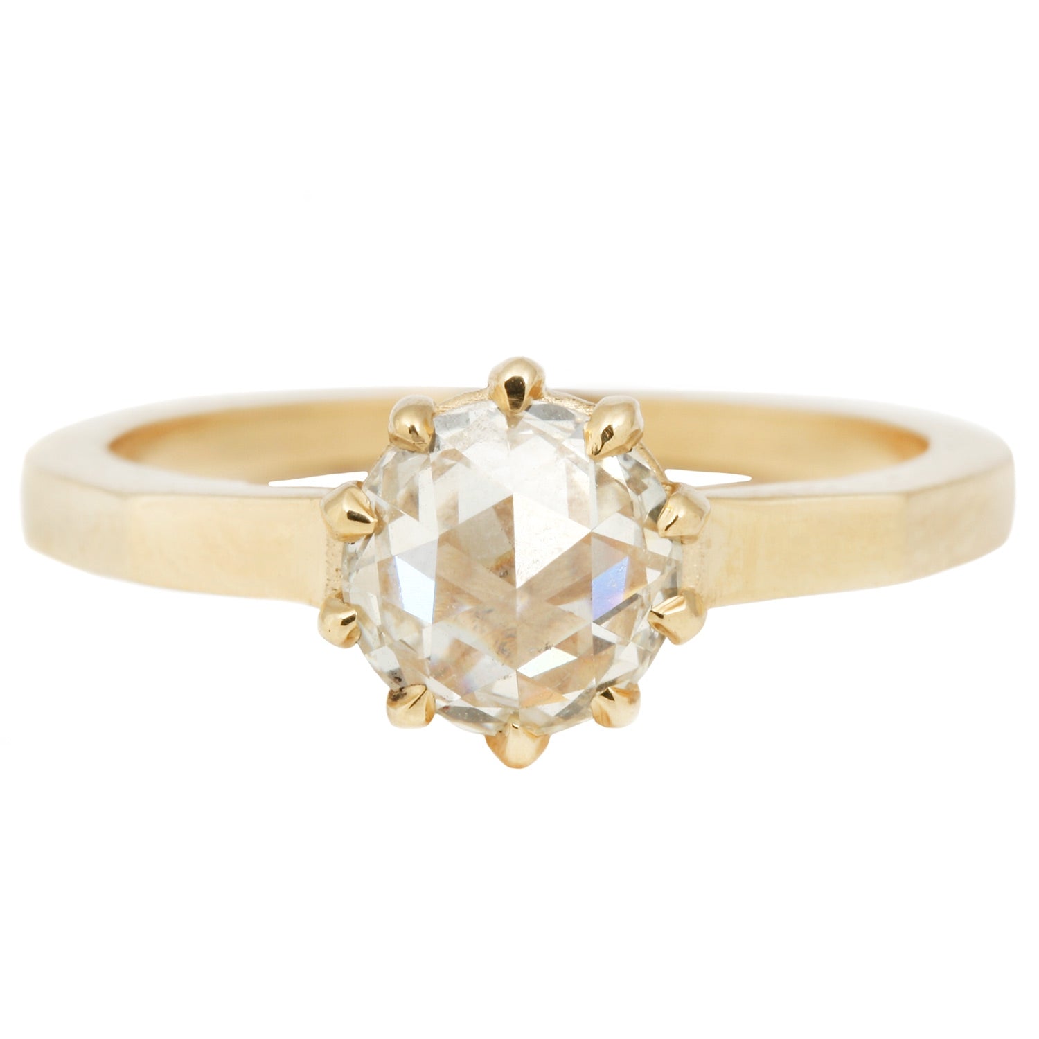 Lauren Wolf - Gold ring with a large diamond on a white background