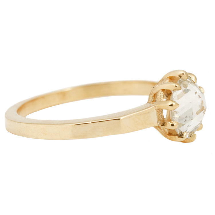 Lauren Wolf - Gold ring with a large diamond on a white background