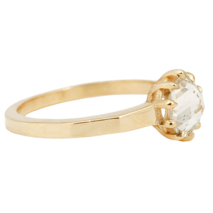 Lauren Wolf - Gold ring with a large diamond on a white background