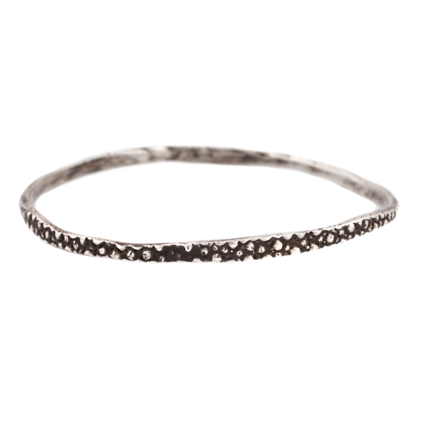 The Silver Stingray Bangle by Lauren Wolf Jewelry shown on a white background