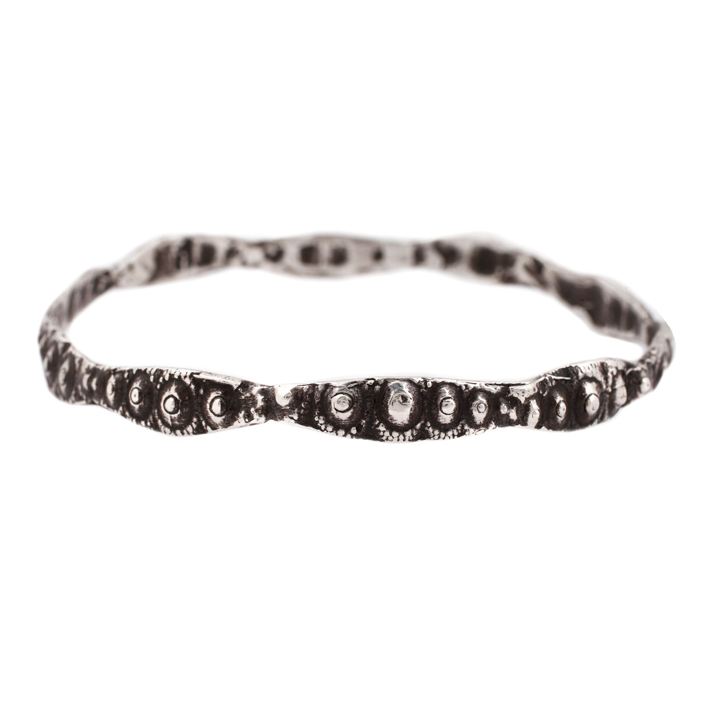 textured silver bangle with oxidized finish against a white background - Lauren Wolf Jewelry | ESQUELETO 