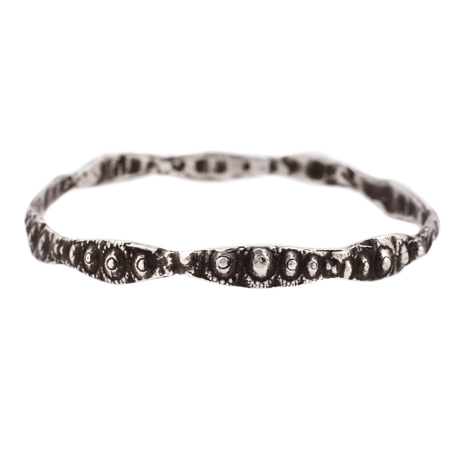 textured silver bangle with oxidized finish against a white background - Lauren Wolf Jewelry | ESQUELETO 