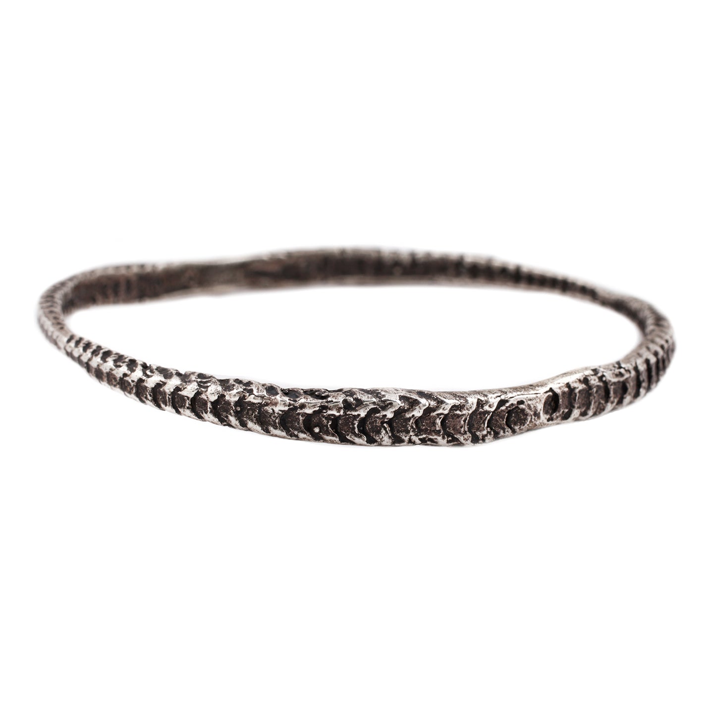 Textured oxidized silver bracelet against a white backdrop - Lauren Wolf Jewelry | ESQUELETO