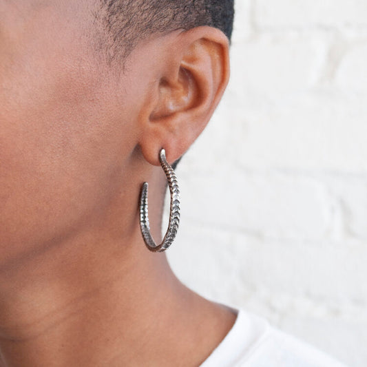 Lauren Wolf Silver Starfish Radial Hoops worn on the ear