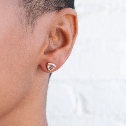 Lauren Wolf Jewelry - 14k yellow gold stud earrings with trillion cut morganite on an ear 