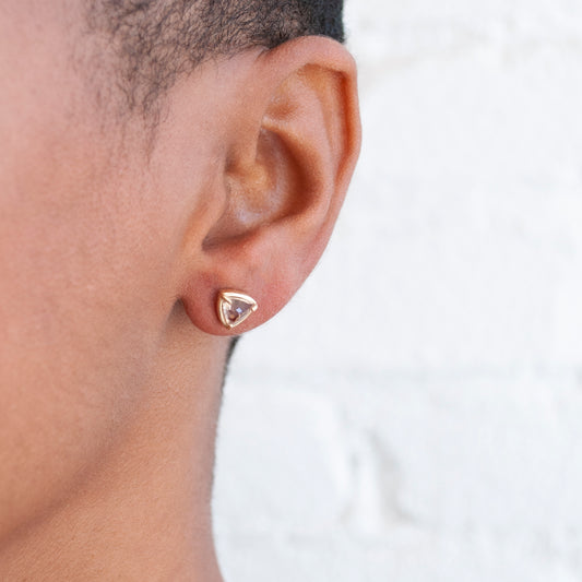 Lauren Wolf Jewelry - 14k yellow gold stud earrings with trillion cut morganite on an ear 
