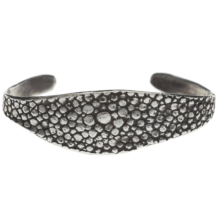 textured oxidized silver bangle against a white backdrop - Lauren Wolf Jewelry | ESQUELETO