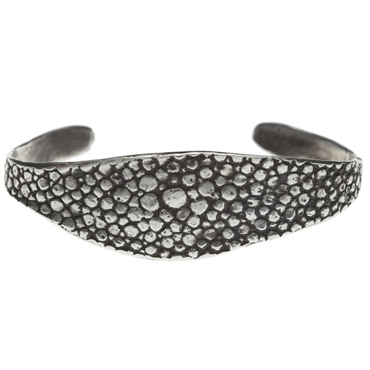 textured oxidized silver bangle against a white backdrop - Lauren Wolf Jewelry | ESQUELETO